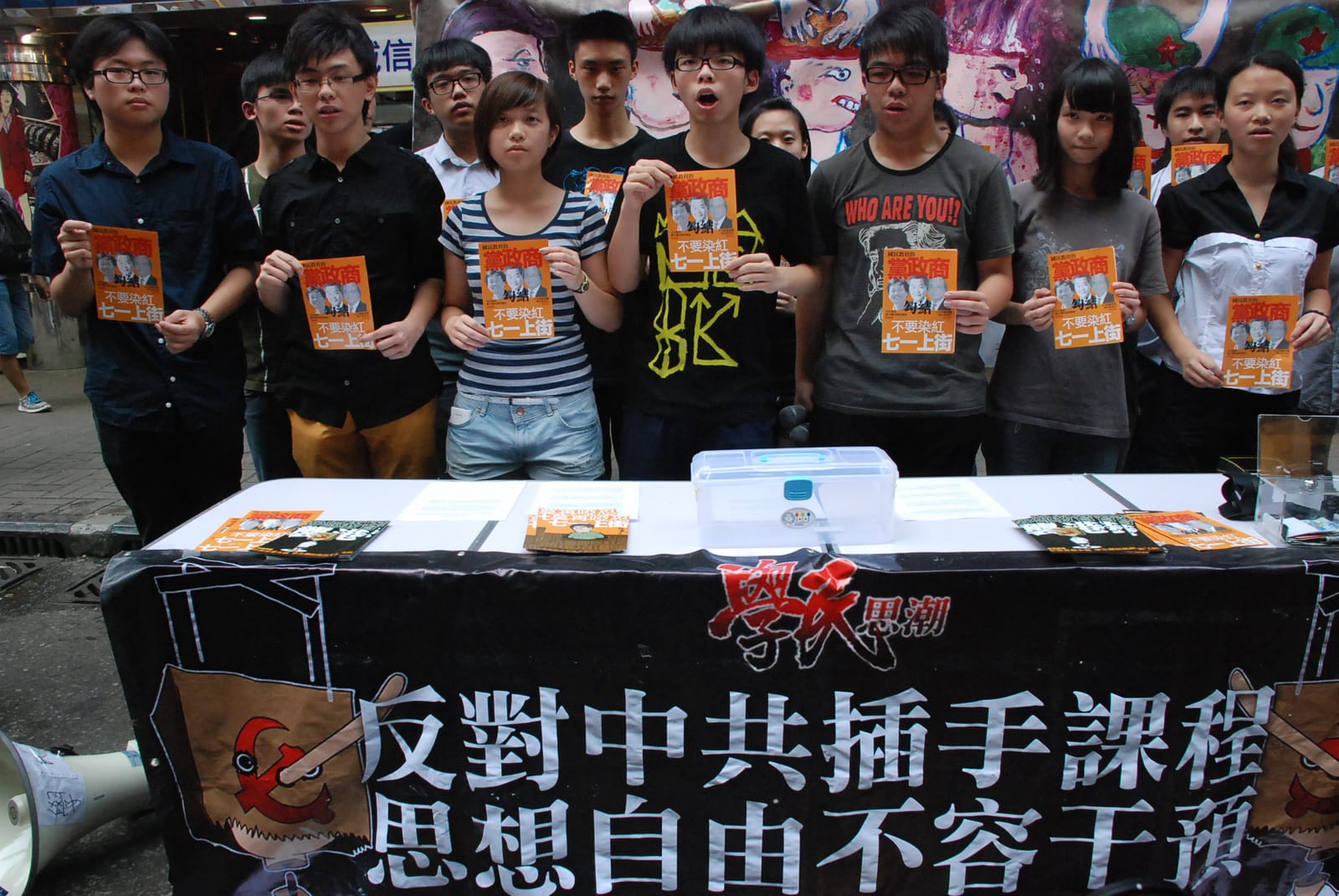 27 June 2012: a year after its founding, Scholarism students at a street booth urge the public to join the 1 July march against the national education curriculum.